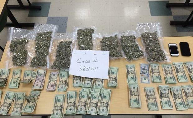 The Chelmsford Police Department seized approximately 1 3/4 pounds of marijuana and $3,055 in cash from a Dracut man.