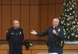 Lt. James Graham (left) and Sgt. Paul Saunders discuss common types of computer, phone and mail scams with residents of Carleton-Williard Village on Dec. 18, 2018. (Courtesy Photo/Bedford Police Department)