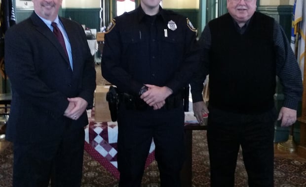 Pictured left-to-right: Saugus Police Chief Domenic J. DiMella, Officer Derek Ryan, and Acting Saugus Town Manager Robert Palleschi. (Courtesy of the Saugus Police Department)