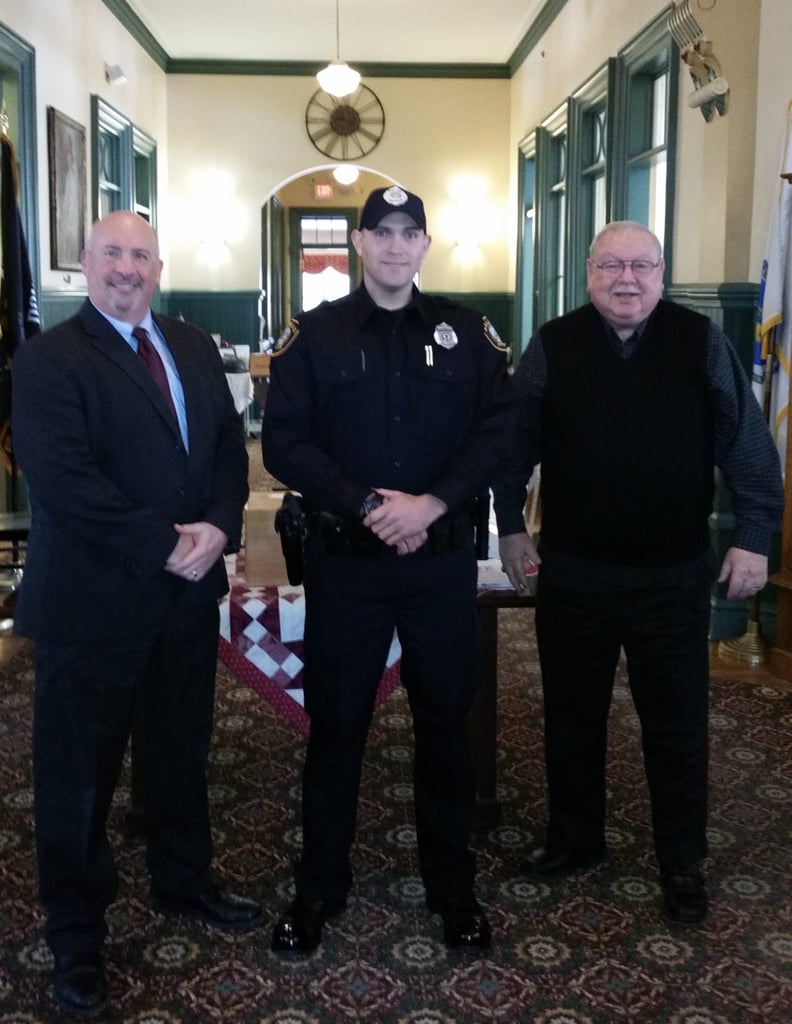 Pictured left-to-right: Saugus Police Chief Domenic J. DiMella, Officer Derek Ryan, and Acting Saugus Town Manager Robert Palleschi. (Courtesy of the Saugus Police Department)