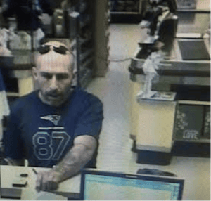 Bedford Police arrested STEPHEN GINGRAS, AGE 39, OF MANCHESTER, N.H., allegedly pictured here robbing a bank in town on Monday. (Courtesy Photo)