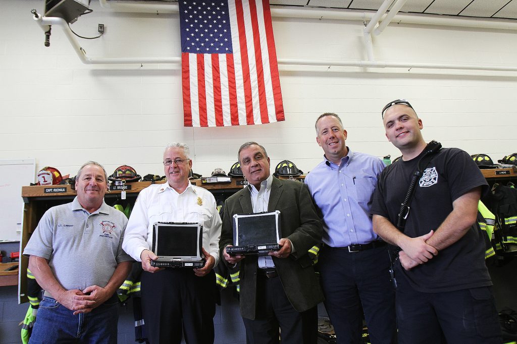 Trinity EMS donated multiple computers to the Groveland Fire Department. Left to right: Lt. Al Credit, Chief Robert Lay, Trinity President and Co-Owner John Chemaly, Christopher Dick, Director of Business Development and Marketing, and Firefighter Taylor Balletto. (Courtesy Photo)