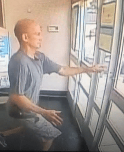 The suspect is seen in video surveillance fleeing Walgreens on Main Street. (Courtesy Photo)