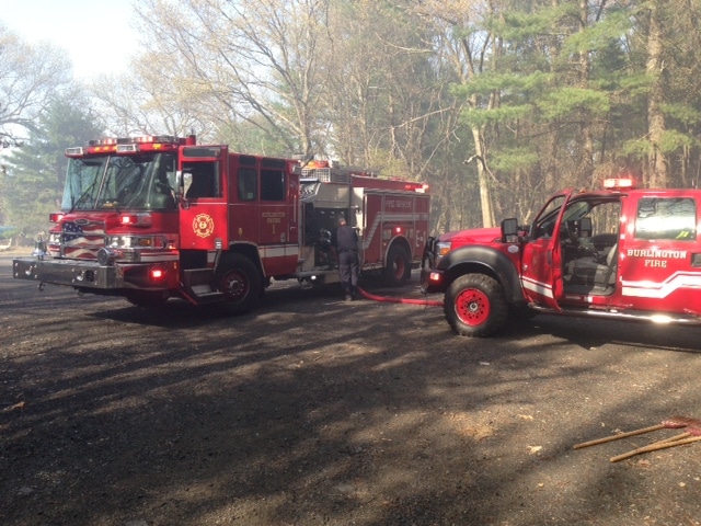 Burlington firefighters helped battle a brush fire near the Burlington Gun Club in BIllerica yesterday.