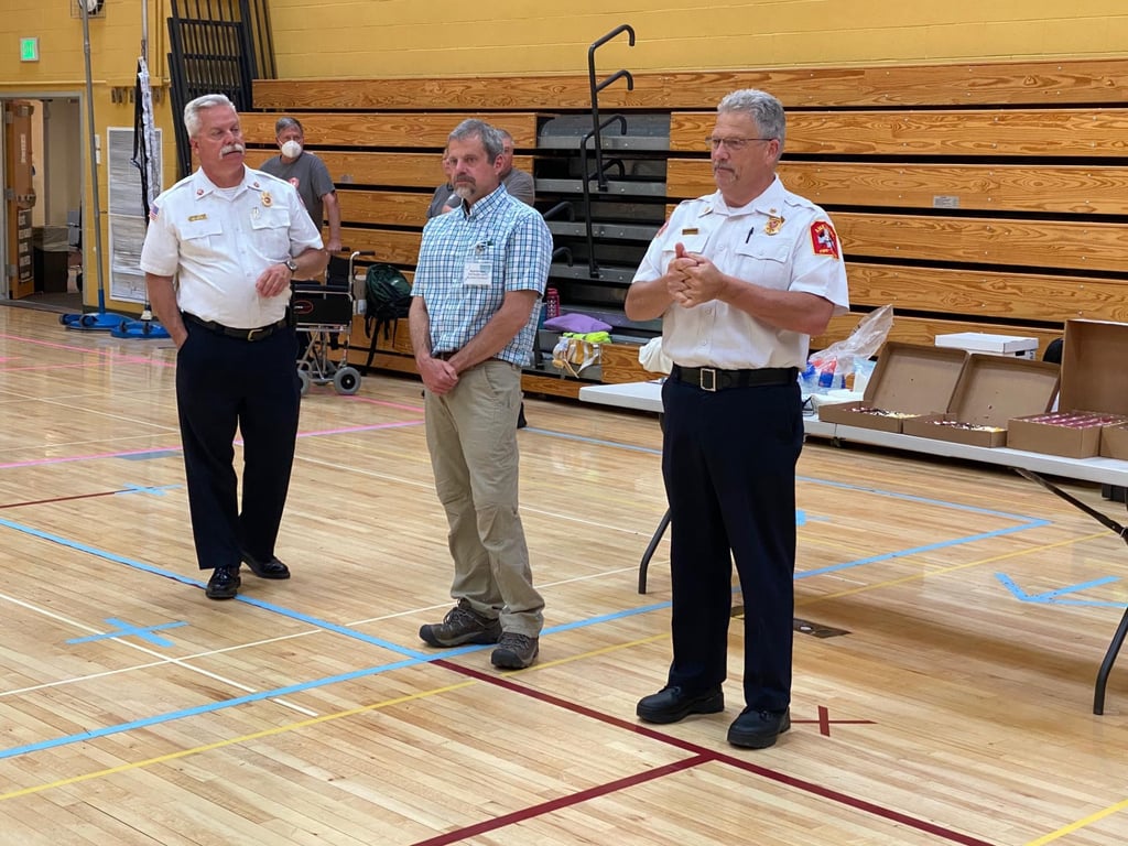 Newburyport Fire Chief Christopher LeClaire, West Newbury Health Agent Paul Sevigny, and Amesbury Fire Chief/Health Director Ken Berkenbush give remarks thanking volunteers at the last large-scale COVID-19 vaccine clinic held by the Lower Merrimack Valley Regional Collaborative on May 22. (Courtesy Photo)