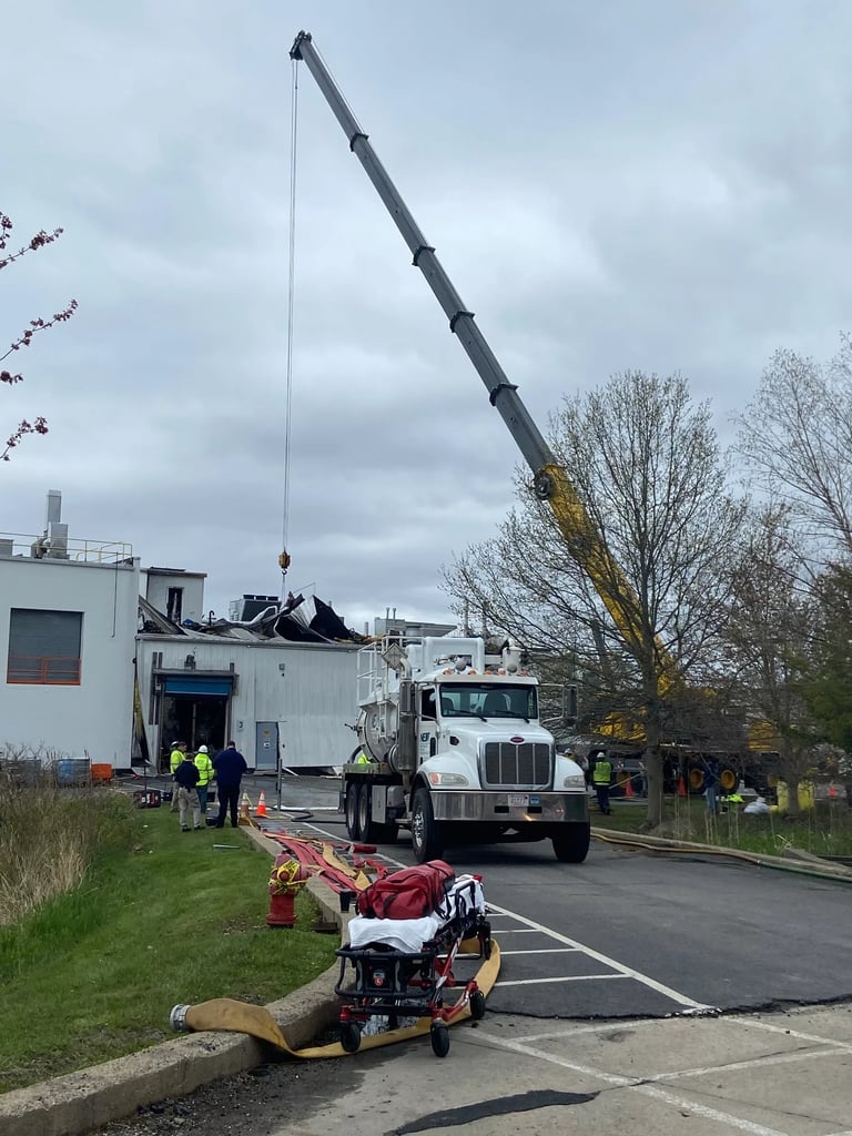 Fire crews and private contractors worked to shore up the compromised structure of the Seqens plant on Friday as removal of chemicals and building materials continued (Courtesy Photo/Newburyport Fire Department)