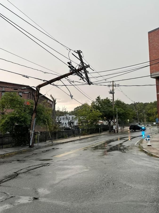 Utility pole broken in half after storm