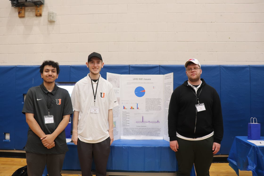 From left: Samuel Abdel-Nour, Chris Szajna and Nathan Fuoss with their project, UHS Wi-Fi Network Speed Issues, at the Medway High School Innovation Showcase on May 1. (Photo courtesy Uxbridge Public Schools)