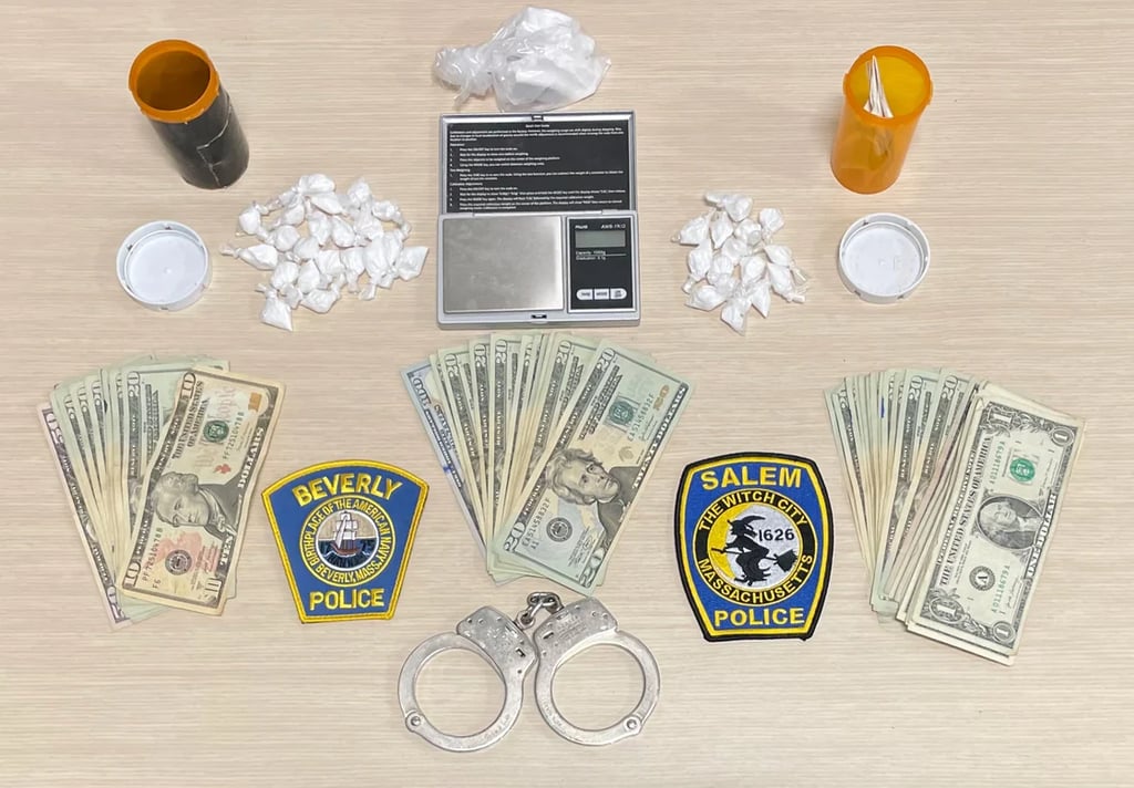 pills, pill bottles, scale, handcuffs, currency, police department patches