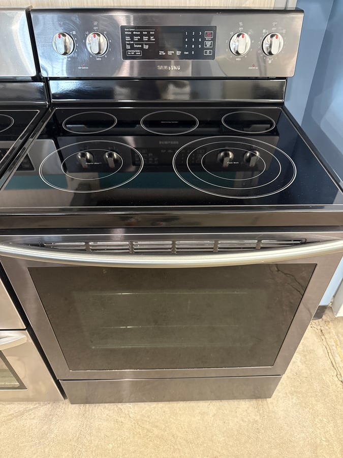 Samsung black stainless glass top range. - Image