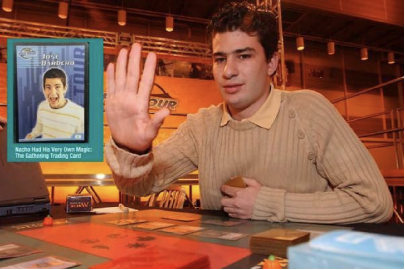 José Barbero playing Magic: The Gathering at a tournament table, holding cards with his custom trading card displayed beside him.