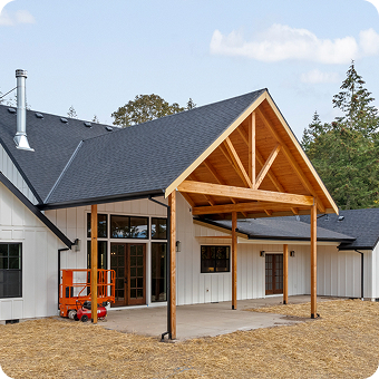 Builders Design, Inc office building exterior with company sign and landscaped entrance in Gresham, Oregon.