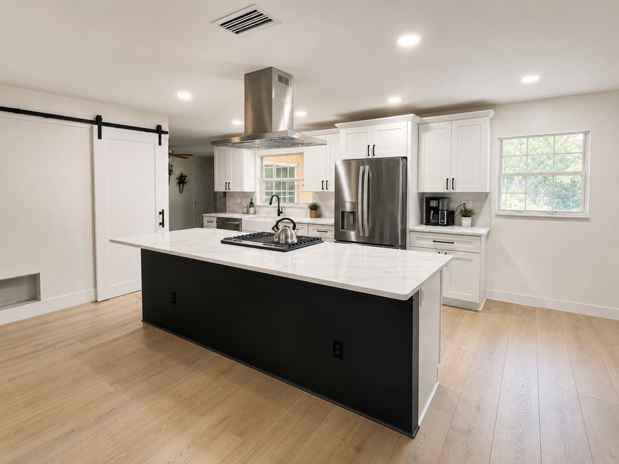 Longwood kitchen remodel with black island, quartz countertops, and stainless hood
