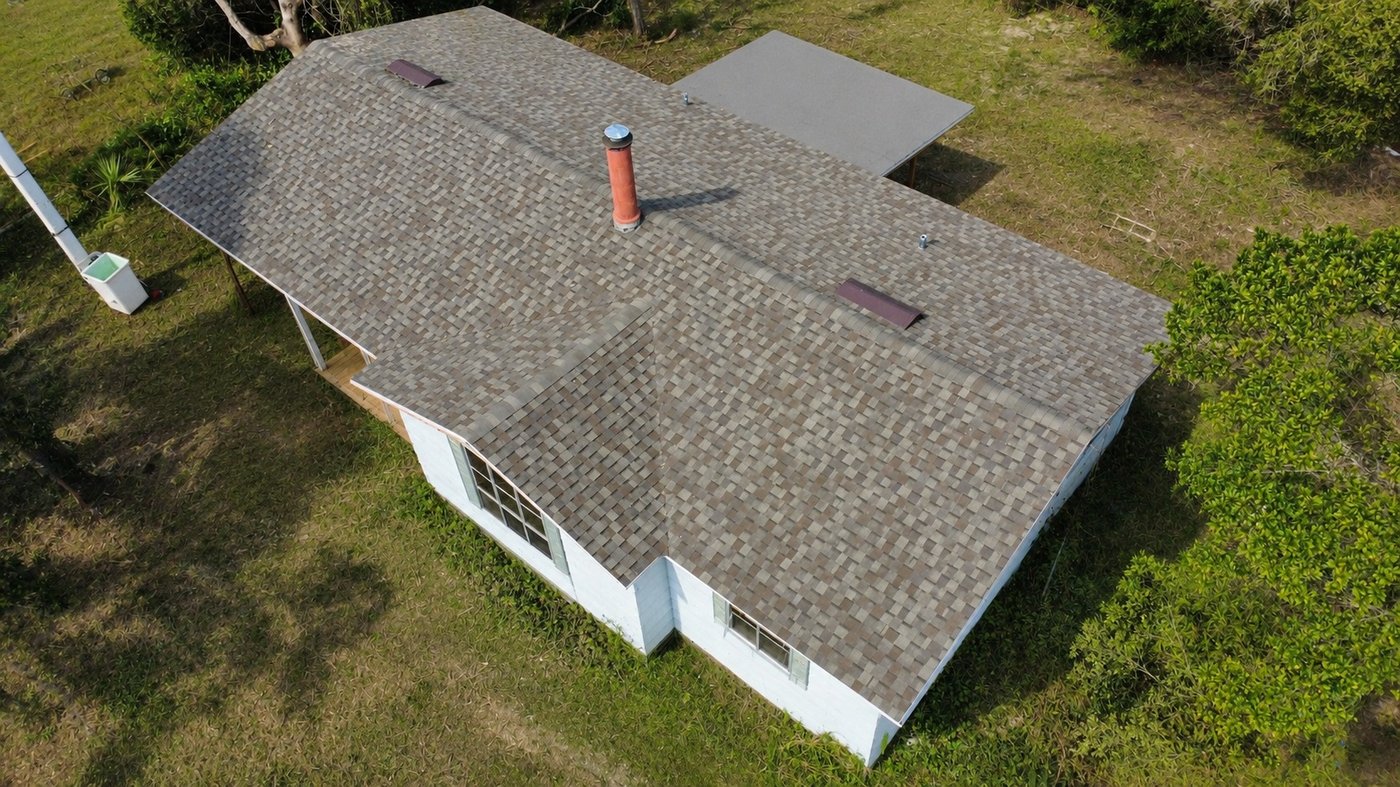 Aerial view of a new shingle roof installed by Herrera Contractors in Sanford