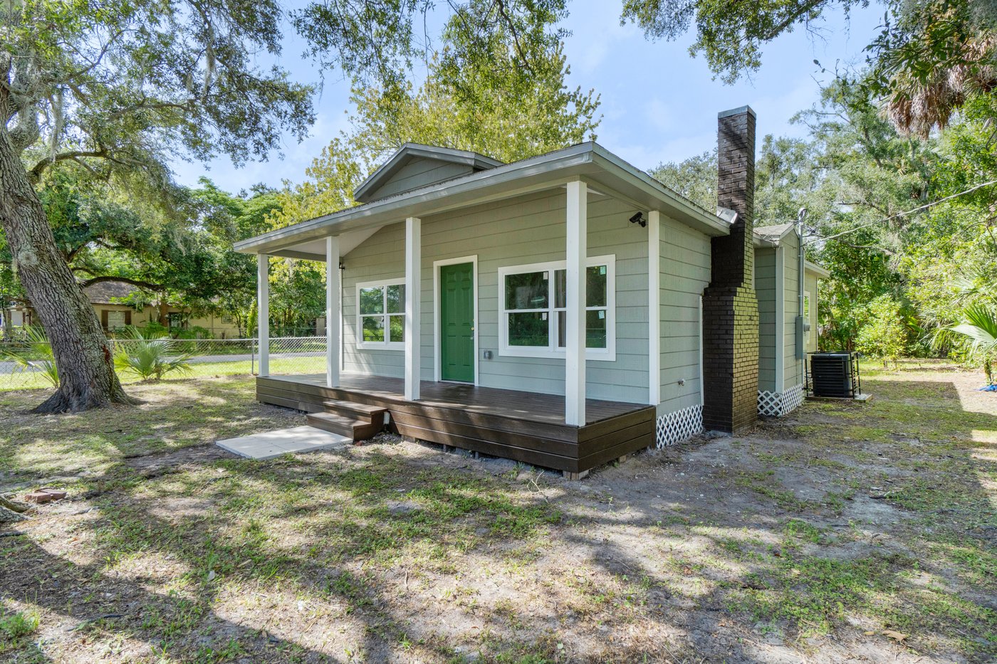 Sanford whole-home renovation with new siding, front porch, and deck