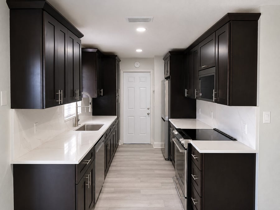 Orlando galley kitchen remodel with espresso cabinets and quartz countertops