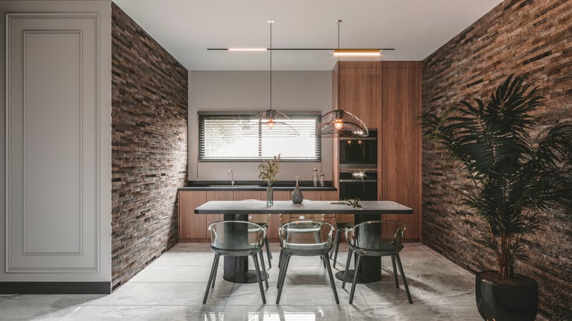 Modern staff kitchen with stone accent walls and glass chairs in Yenişehir Mersin office interior