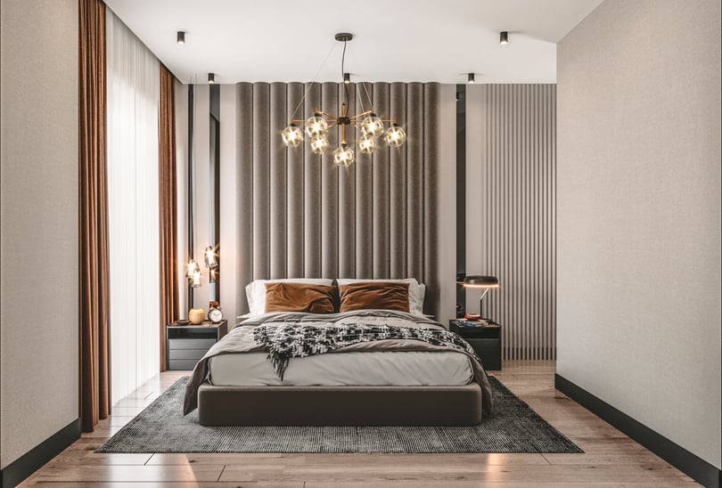 Warm modern bedroom interior in Milas Muğla duplex apartment with upholstered bed and built in wardrobe