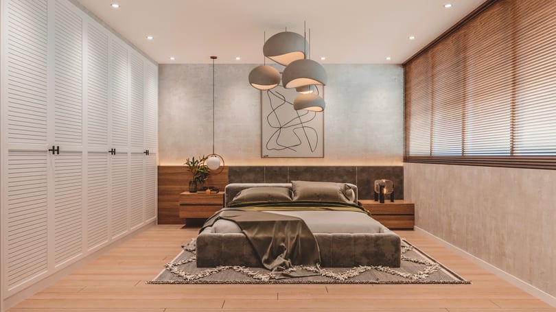 Modern loft-style master bedroom interior design in a duplex apartment in Amsterdam, Netherlands with upholstered platform bed, custom wooden headboard wall, built-in white louvered wardrobes