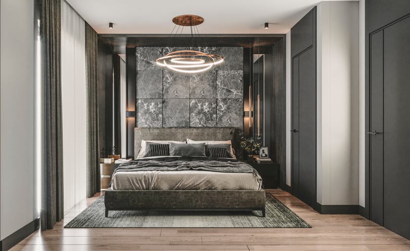 Elegant duplex apartment bedroom interior in Milas Muğla with dark accent wall and warm ambient lighting