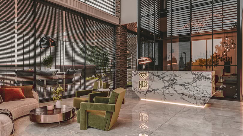 Stylish entrance waiting area with green armchairs and modern lighting in Yenişehir Mersin office interior