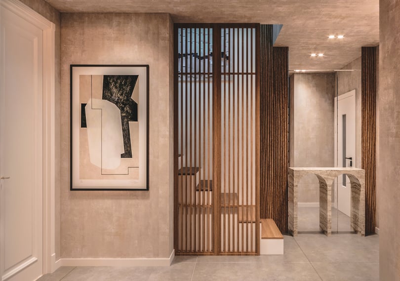 Minimalist staircase and corridor interior in a duplex apartment in Amsterdam featuring textured plaster walls, wood accents and modern recessed lighting