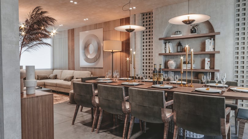 Contemporary open kitchen and dining space in Amsterdam duplex apartment with marble-effect refrigerator panels, custom cabinetry and elegant dining table setting