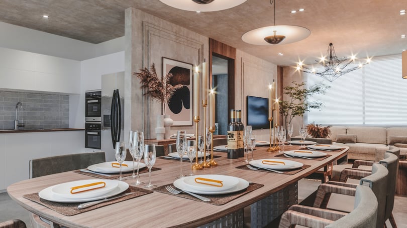 Luxury dining room interior in Amsterdam duplex apartment with long wooden table, upholstered chairs, decorative shelving niche and layered lighting design