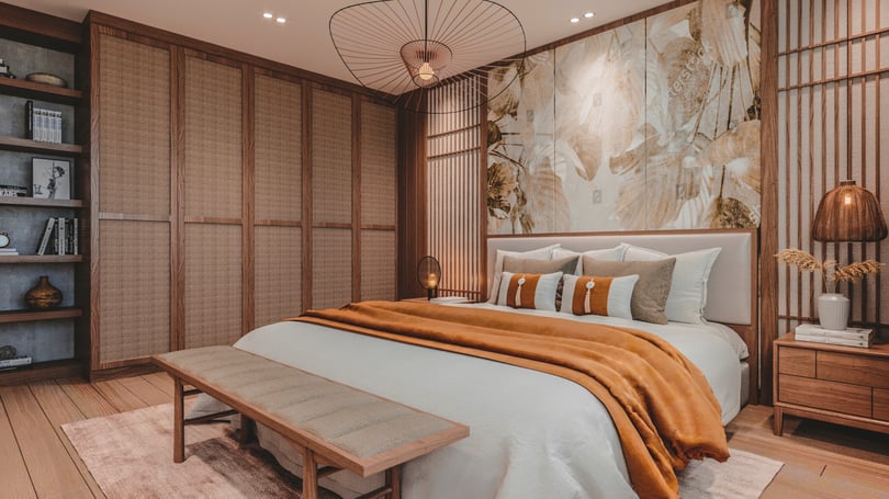 Luxury bedroom design in Amsterdam, Netherlands duplex apartment showcasing floor-to-ceiling built-in cabinetry, statement pendant light, natural oak flooring and layered textile styling