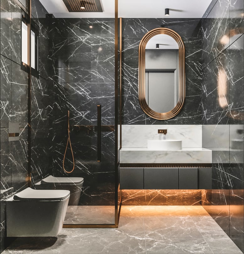 Luxury black marble bathroom design in Milas Muğla duplex apartment with oval mirror, wall mounted vanity and warm LED lighting