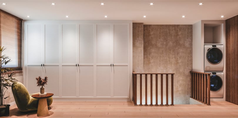 Minimalist mezzanine hallway design in Amsterdam duplex home with integrated storage units, natural oak flooring and stacked washer-dryer niche