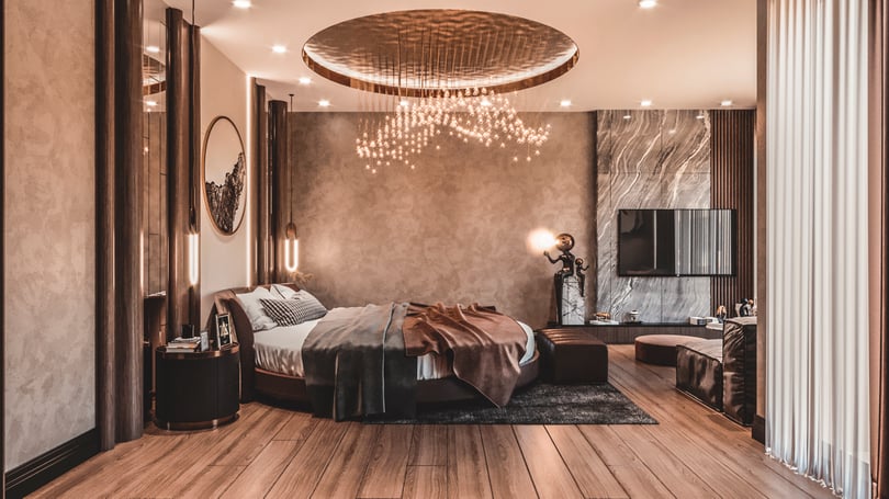 High-end bedroom design in Göktürk, Istanbul showcasing marble TV wall unit, floor-to-ceiling curtains, and sophisticated ambient lighting