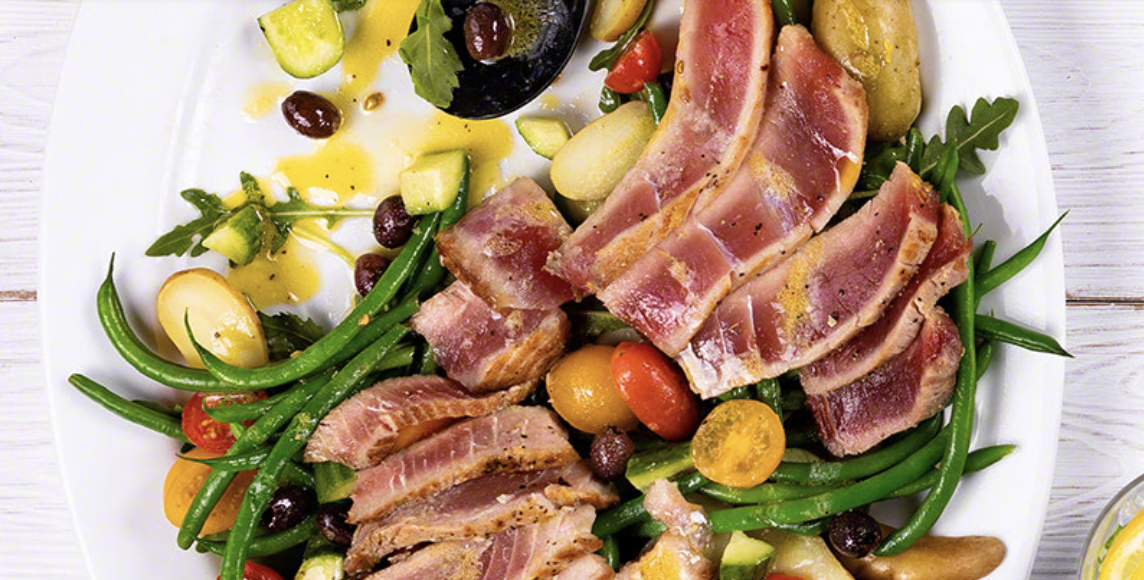 Meat and vegetables on a white plate