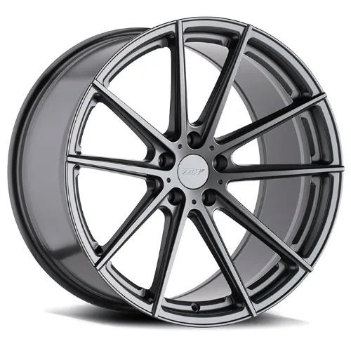 A silver alloy car wheel with a multi-spoke design and a polished finish, positioned at an angle to show depth and detail.