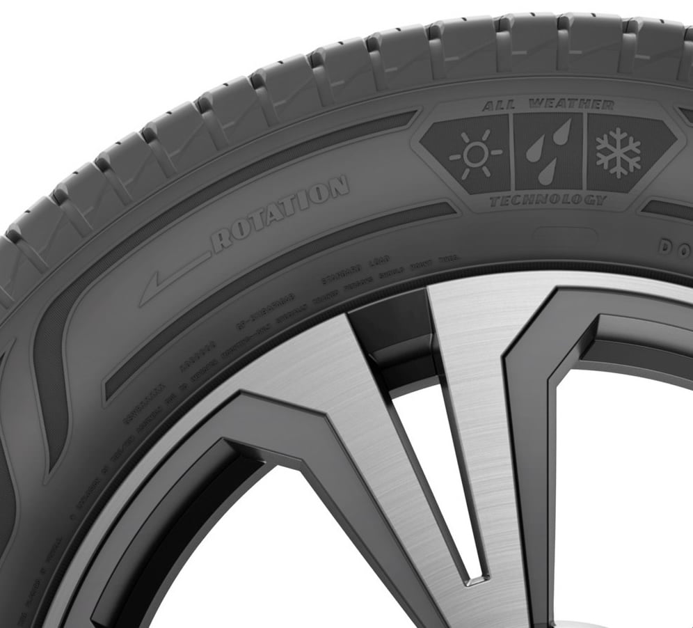 A closeup of the word Rotation with an arrow point to the left on this Goodyear all weather tire. 
