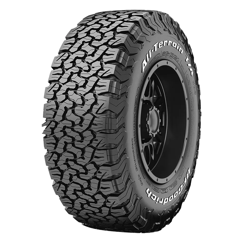 A rugged all-terrain tire with deep tread patterns designed for off-road use, featuring the brand name "BF Goodrich" and model "All-Terrain T/A" displayed on the sidewall.
