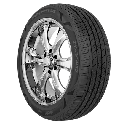 An Achilles Touring Sport AS tire and wheel featuring a chrome-plated alloy rim with five spokes and a black rubber tire labeled 'Touring Sport A/S 215/55R17' on the sidewall.