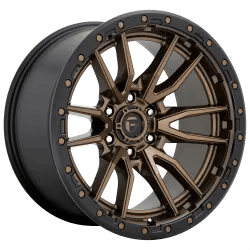 Bronze alloy wheel with a multi-spoke design and rivet details around the rim by Fuel Off Road
