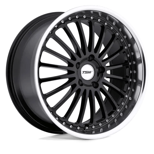 A black alloy wheel with a TSW logo on the center cap, featuring a multi-spoke design and a polished silver rim.