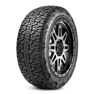 Black tire with rugged tread pattern on a silver alloy wheel.