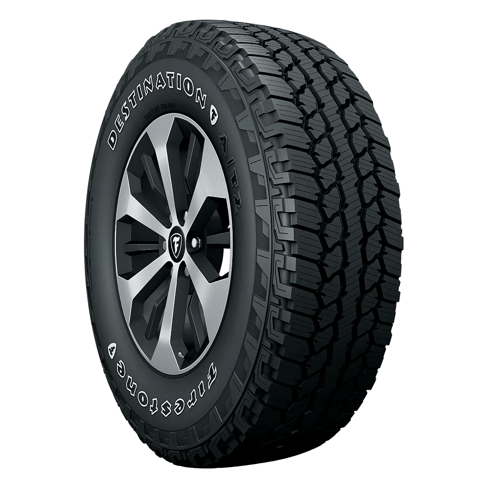 All-terrain tire with aggressive tread pattern and branded sidewall, designed for optimal traction on various surfaces.