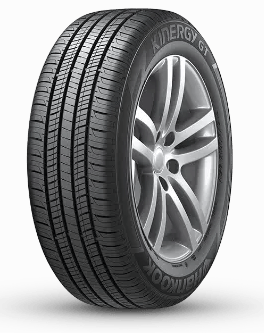 A black car tire with visible tread patterns and the words "Kinergy GT" and "Hankook" on the sidewall.