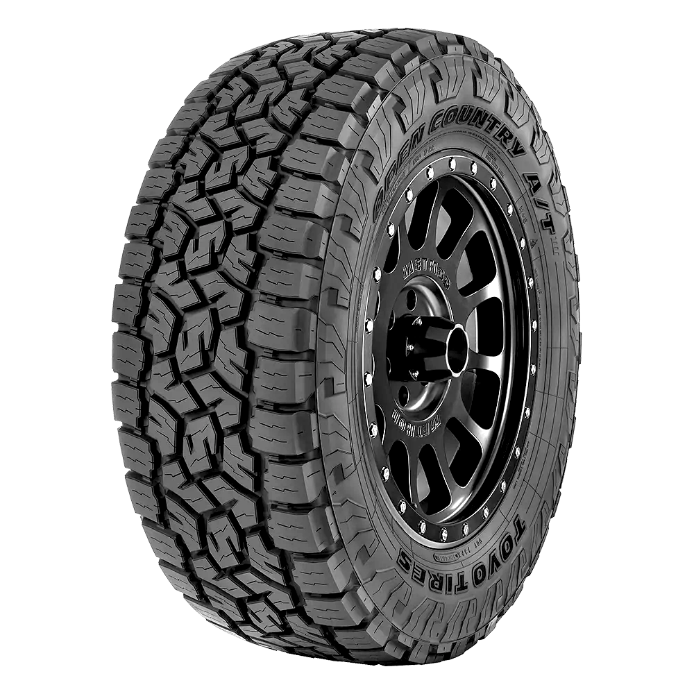 Front side view of a toyo open country at tire with aggressive tread blocks, mounted on a black Method wheel.