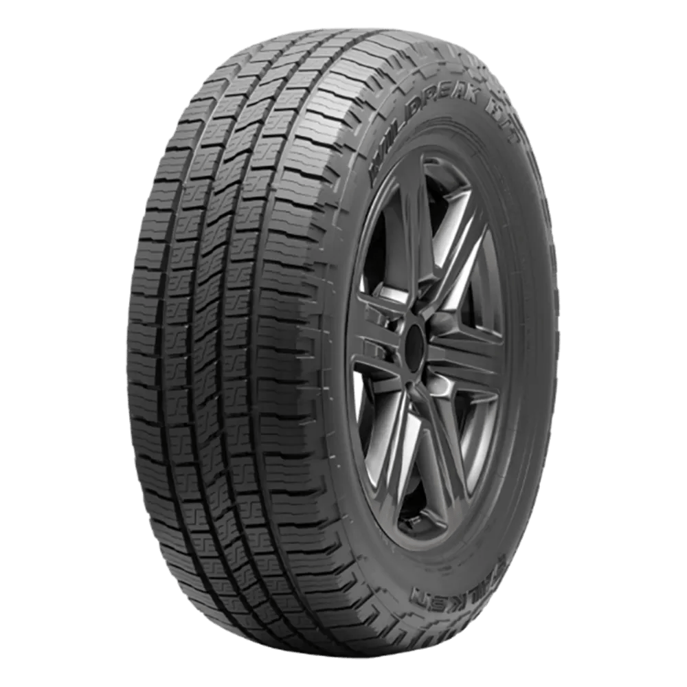 A black car tire with a detailed tread pattern and visible rim, viewed from the side angle.