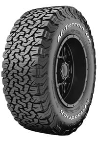A black all-terrain tire with a rugged tread pattern and visible brand name on the sidewall.