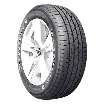 A Firestone Destination LE3 tire with a detailed tread pattern and the brand logo on a silver alloy wheel.