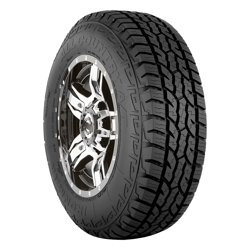 A black all-terrain tire with rugged tread and the words 'All Country' and 'Ironman' visible on the sidewall, mounted on a shiny chrome wheel.