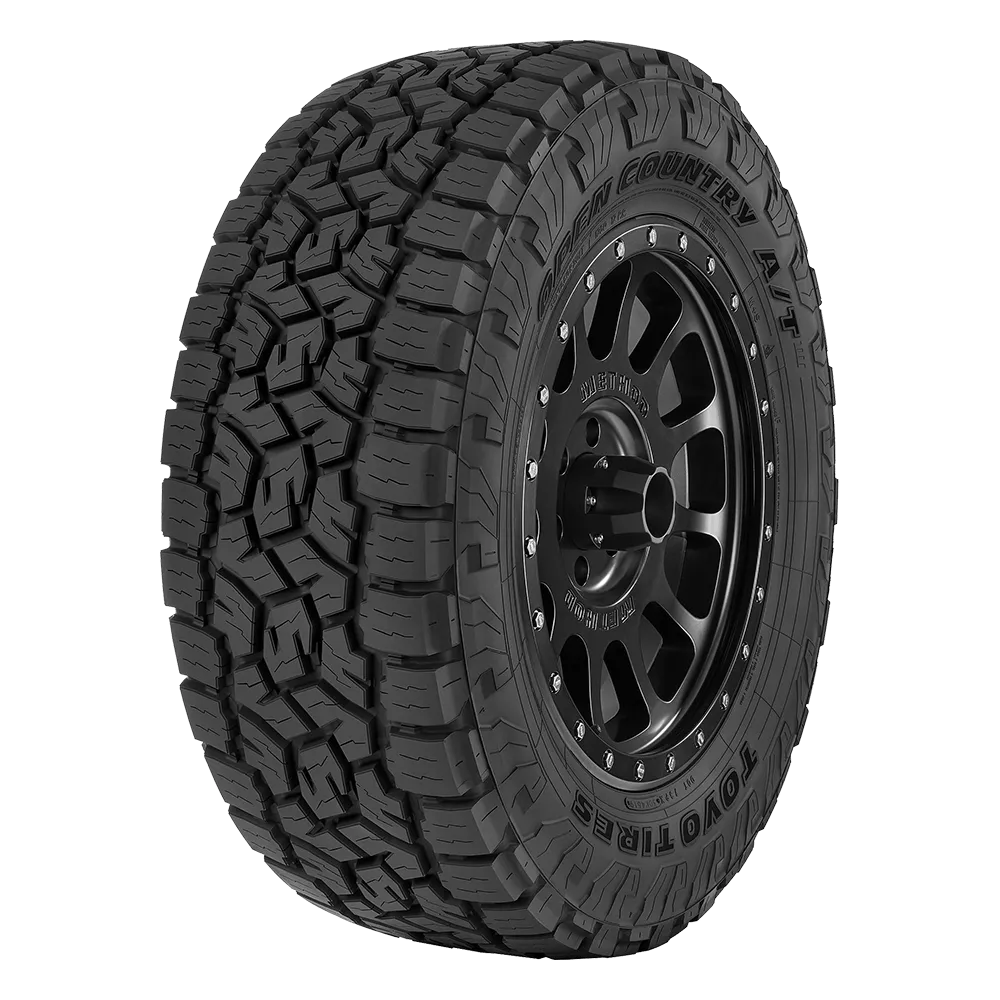 A black Open Country A/T tire on a black matte finished rim.