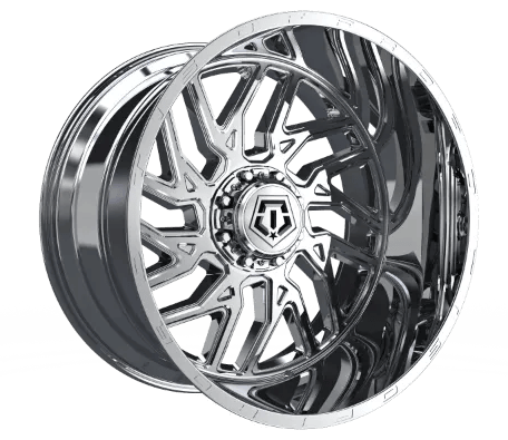 Chrome alloy wheel by TIS with a multi-spoke design and a central emblem.