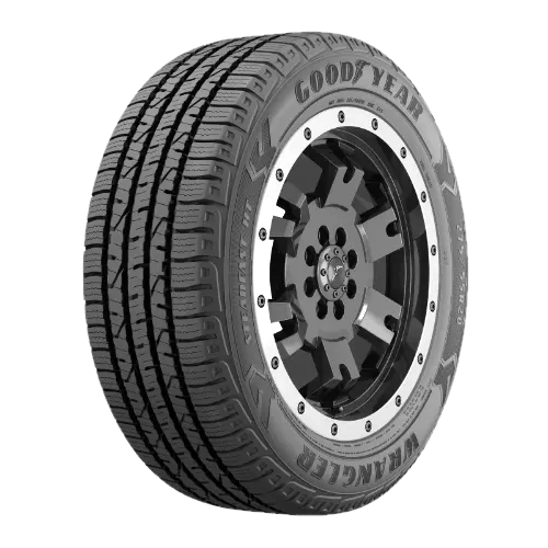 A Goodyear Wrangler tire with a detailed tread pattern and black alloy wheel rim.